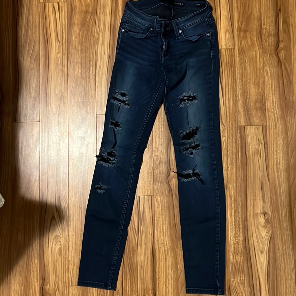 Dark denim with ripped front design soft and stretchy. Low rise